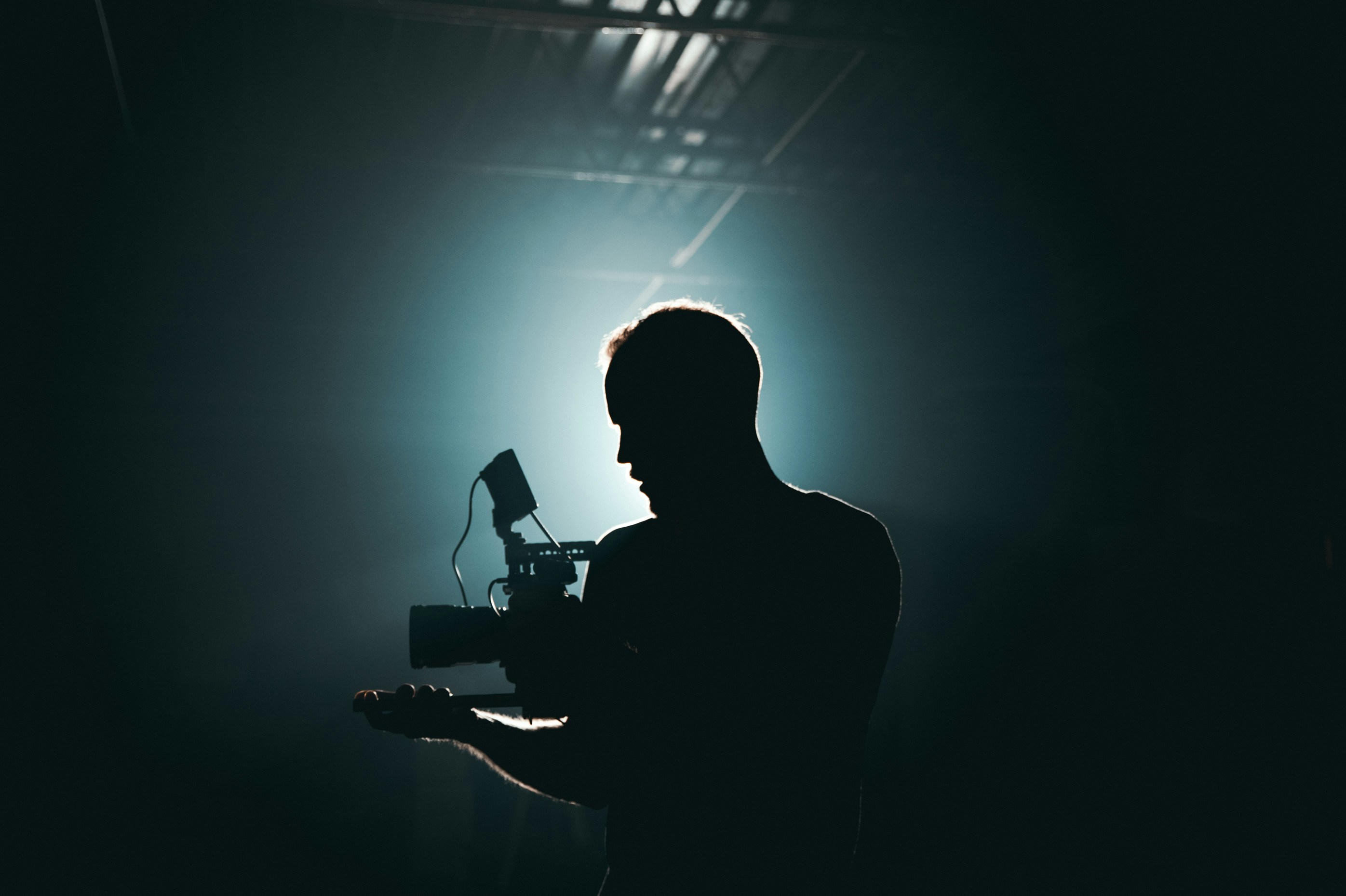 A person holding a high-end industrial camera